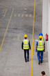 © KOTO - Supervisor and workers walking in factory