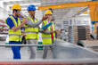 © KOTO - Supervisor and workers talking in warehouse