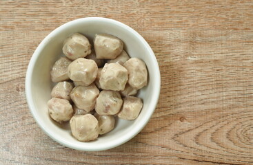 pork ball made from mashed meat boiled in hot water on cup