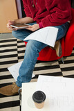 Fototapeta  - Man reviewing paperwork in cosy office