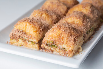 Wall Mural - Traditional turkish new dessert cold milky baklava with pistachio (Turkish name; soguk baklava)