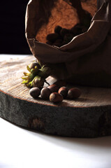 Wall Mural - Hazelnut close-up. Hazelnuts in a paper bag on a wooden background. Hazelnut background, healthy food. Corylus. 