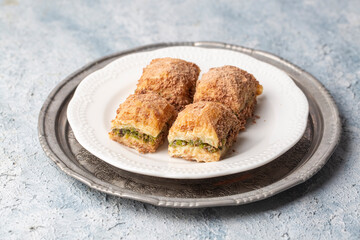 Wall Mural - Traditional turkish new dessert cold milky baklava with pistachio (Turkish name; soguk baklava)