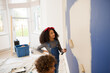 © KOTO - Happy children painting wall