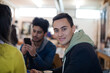 © KOTO - Young adults using smart phones at table
