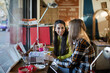 © KOTO - Young female college students studying in cafe