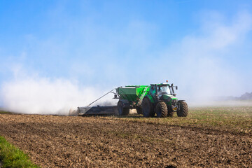 tractor liming the ground