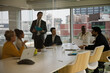 © KOTO - Businessman leading conference room meeting