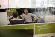 © KOTO - Business people talking in open plan office