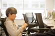 © KOTO - Portrait confident businessman using smartphone in office