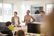 © KOTO - Business people talking in open plan office