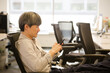 © KOTO - Portrait confident businessman using smartphone in office