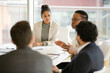 © KOTO - Businesswoman leading conference room meeting