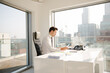 © KOTO - Businessman working at desk in modern office