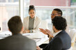 © KOTO - Businesswoman leading conference room meeting