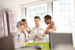 © KOTO - Business people talking in open plan office