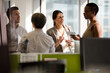© KOTO - Business people talking in open plan office