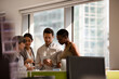 © KOTO - Business people talking in open plan office