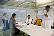 © KOTO - Businesswoman leading conference room meeting