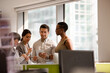 © KOTO - Business people talking in open plan office