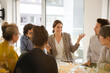 © KOTO - Business people enjoying sushi lunch in conference room