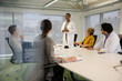 © KOTO - Businesswoman leading conference room meeting
