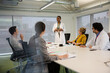 © KOTO - Businesswoman leading conference room meeting