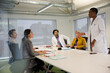 © KOTO - Businesswoman leading conference room meeting