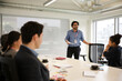 © KOTO - Businessman leading conference room meeting