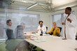 © KOTO - Businesswoman leading conference room meeting