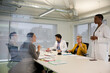 © KOTO - Businesswoman leading conference room meeting