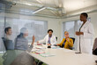 © KOTO - Businesswoman leading conference room meeting