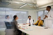 © KOTO - Businesswoman leading conference room meeting