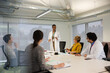 © KOTO - Businesswoman leading conference room meeting