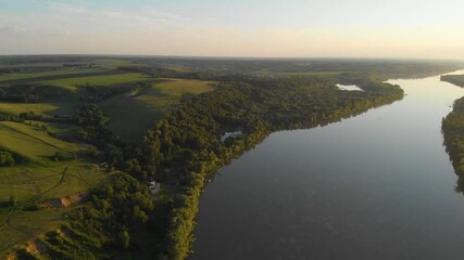 Wall Mural - Aerial view of big siberian Ob river, river bank in beauty summer evening, 4K drone footage.