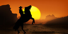 Cowboy On Horseback At Sunset