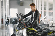 © prostooleh - Handsome man choosing a motorcycle to buy