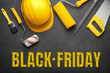 Construction tools with text BLACK FRIDAY on dark background