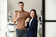 © Pixel-Shot - Business colleagues drinking coffee in office