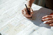© Austockphoto - Working with plans and architectural drawings for renovation