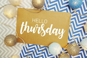 Wall Mural - hello thursday typography text on paper card with led cotton balls decoration