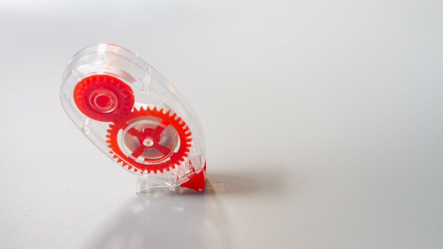 Correction tape for correcting text in the form of a convenient red pencil on a gray background