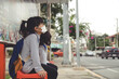 © FAMILY STOCK - Cute asian child girl wearing protection mask to against air smog pollution with PM 2.5 in the city