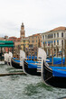 Gondolas parked on the Canal Grande in Venice, with the palaces in the background