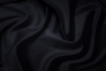 Black fabric texture background, wavy fabric slippery black color, luxury satin or silk or wool cloth texture.