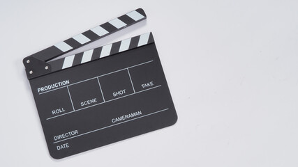 clapperboard or movie slate use in video production, film and cinema industry. it's black color on w