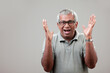 Mature man of Indian ethnicity with a cheering expression