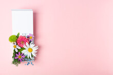 Stylish Fresh Flowers Arrangement In White Gift Box On Pink Background
