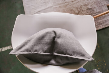 Canvas Print - Closeup of a gray pillow on the seat. Top view.