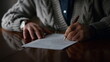 © stockbusters - Elderly man hands working document at home. Old male arms making marks contract